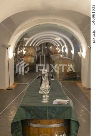 Wine cellar with tasting glasses set on barrel table Wine cellar with tasting glasses set on barrel table 140961938