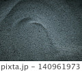 Textured sand and a light trace on the surface 140961973