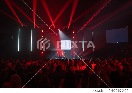 Audience at motivational conference with dynamic lighting effects 140962293