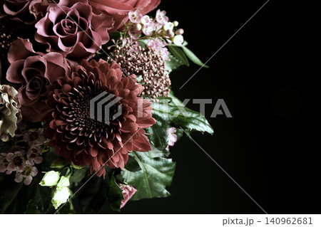 Beautiful bouquet of different flowers on black background, space for text. Floral card design with dark vintage effect 140962681