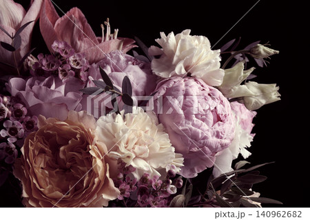 Beautiful bouquet of different flowers on black background. Floral card design with dark vintage effect Beautiful bouquet of different flowers on black background. Floral card design with dark vintage effect 140962682