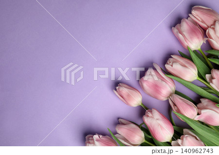 Beautiful pink spring tulips on lilac background, flat lay. Space for text 140962743