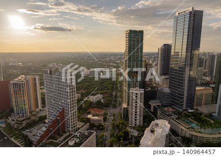 View from above of skyscraper buildings in downtown district of Miami, Florida, USA. American city with business financial district View from above of skyscraper buildings in downtown district of Miami, Florida, USA. American city with business financial district 140964457