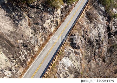 Travelling along scenic Highlands Road. Golden foliage and rugged slopes make this North Carolina highway a perfect fall escape. Travelling along scenic Highlands Road. Golden foliage and rugged slopes make this North Carolina highway a perfect fall escape. 140964479