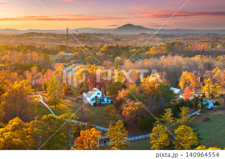 Rural estate houses between golden fall foliage in Appalachian countryside. Tranquil southern autumn atmosphere. Rural estate houses between golden fall foliage in Appalachian countryside. Tranquil southern autumn atmosphere. 140964554
