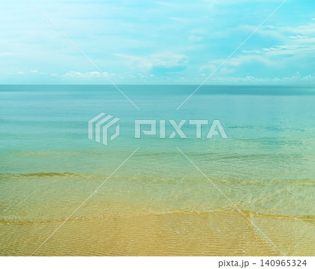 Calm Turquoise Sea with Sandy Beach and Blue Sky 140965324