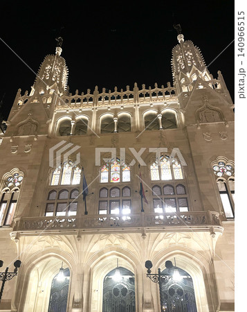 Neo-Gothic Building in Hungary at Night - Illuminated Historic Architecture with Towers Neo-Gothic Building in Hungary at Night - Illuminated Historic Architecture with Towers 140966515