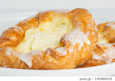 Cheese filled danish on white background Cheese filled danish on white background 140966630
