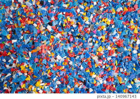 Plastic colorful pieces recycling shredded for industrial use. Plastic colorful pieces recycling shredded for industrial use. 140967143