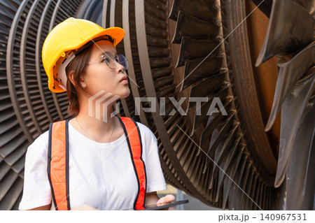 Young Asian engineer teen woman working service power plant turbine fan blade electrical generator 140967531
