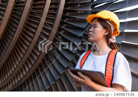 Young Asian engineer teen woman working service power plant turbine fan blade electrical generator Young Asian engineer teen woman working service power plant turbine fan blade electrical generator 140967536