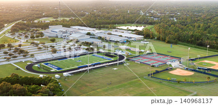 Public high school open air sports facilities in North Port, Florida. American football stadium, tennis courts and baseball diamond sport infrastructure Public high school open air sports facilities in North Port, Florida. American football stadium, tennis courts and baseball diamond sport infrastructure 140968137
