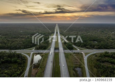 American highway bridge with fast moving traffic in evening. Interstate transportation concept American highway bridge with fast moving traffic in evening. Interstate transportation concept 140968159