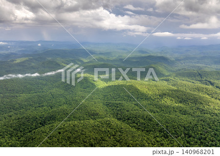Smokey mountains summer woods. Appalachian mountains in North Carolina with fresh green forest trees in summertime season. Beauty of USA nature Smokey mountains summer woods. Appalachian mountains in North Carolina with fresh green forest trees in summertime season. Beauty of USA nature 140968201