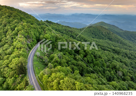 Car road trip on Blue Ridge Parkway in North Carolina Appalachian mountains in summer season at sunset. Summertime landscape of beautiful nature Car road trip on Blue Ridge Parkway in North Carolina Appalachian mountains in summer season at sunset. Summertime landscape of beautiful nature 140968235