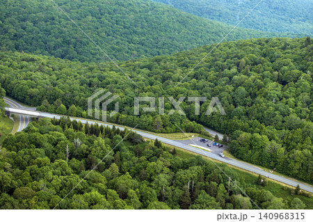 Beacon Heights parking lot overlook on Blue Ridge Parkway road in summer woods of Appalachian mountains. Road trip driving in wild nature in summertime season Beacon Heights parking lot overlook on Blue Ridge Parkway road in summer woods of Appalachian mountains. Road trip driving in wild nature in summertime season 140968315