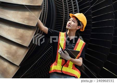 Professional engineer female working service power plant turbine fan blade electrical generator Professional engineer female working service power plant turbine fan blade electrical generator 140968531