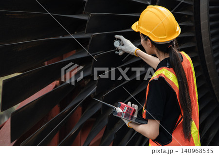 Professional engineer female working service power plant turbine fan blade electrical generator 140968535
