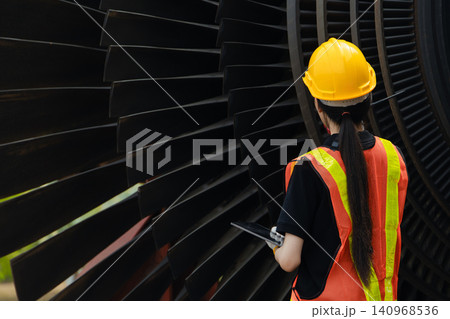 Professional engineer female working service power plant turbine fan blade electrical generator Professional engineer female working service power plant turbine fan blade electrical generator 140968536