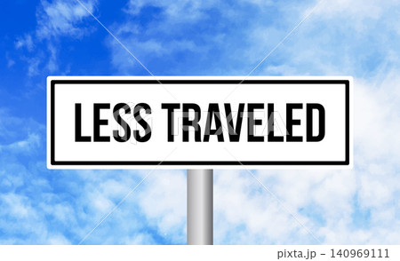 Less traveled road sign on blue sky background Less traveled road sign on blue sky background 140969111