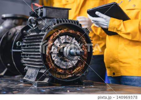 Engineer Checking DC Motor, Technician Man in Garage check inspecting service maintenance Stator. 140969378