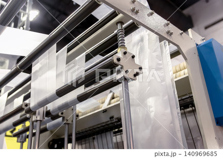 Plastic bag making machine, Packaging machinery, Plastic manufacturing, Industrial automation, Production line. Plastic bag making machine, Packaging machinery, Plastic manufacturing, Industrial automation, Production line. 140969685