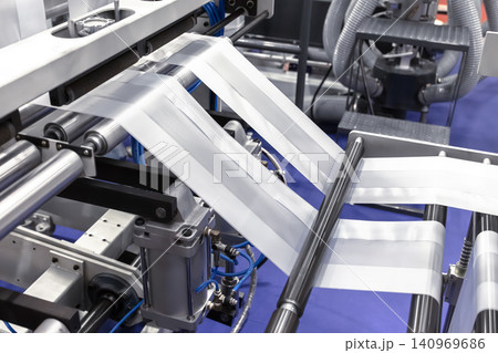 Plastic bag making machine, Packaging machinery, Plastic manufacturing, Industrial automation, Production line. Plastic bag making machine, Packaging machinery, Plastic manufacturing, Industrial automation, Production line. 140969686