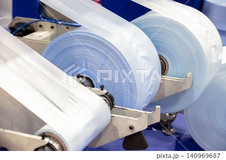 Plastic bag making machine, Packaging machinery, Plastic manufacturing, Industrial automation, Production line. Plastic bag making machine, Packaging machinery, Plastic manufacturing, Industrial automation, Production line. 140969687