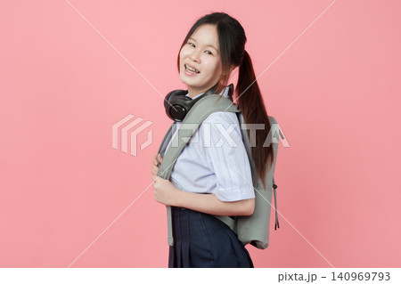 Portrait Thai student in uniform, Asian teen girl cute pretty cheerful standing happy smiling, Portrait Thai student in uniform, Asian teen girl cute pretty cheerful standing happy smiling, 140969793