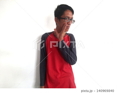 Energetic Asian Man in Batik Showing Hands with Surprised Expression 140969840