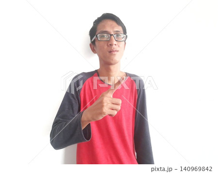 Energetic Asian Man in Batik Showing Hands with Surprised Expression 140969842