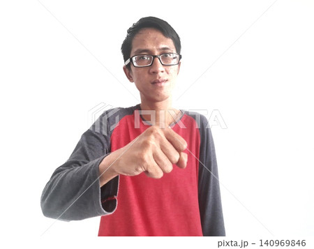 Energetic Asian Man in Batik Showing Hands with Surprised Expression Energetic Asian Man in Batik Showing Hands with Surprised Expression 140969846