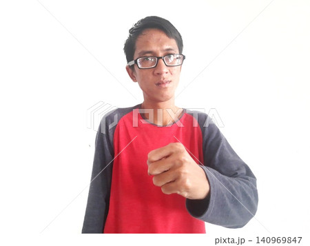 Energetic Asian Man in Batik Showing Hands with Surprised Expression Energetic Asian Man in Batik Showing Hands with Surprised Expression 140969847