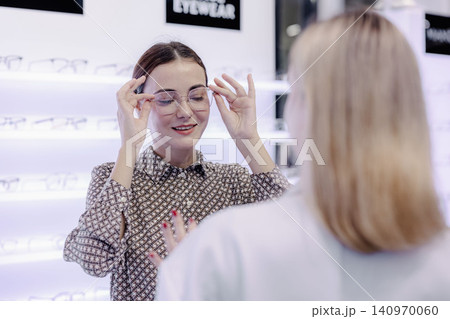 Optical store, Glasses shop staff service customer eyeglasses, Professional eyewear consultation 140970060