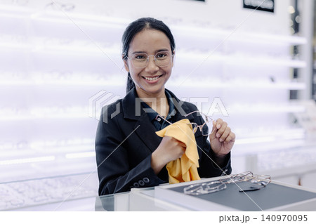 Optical store, Glasses shop staff service sales agent eyeglasses, Professional eyewear consultation Optical store, Glasses shop staff service sales agent eyeglasses, Professional eyewear consultation 140970095