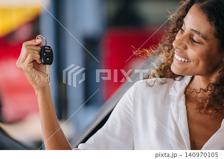 Woman showing car key. Enjoy fix car service. Satisfied car maintenance in garage, Sell Rent car Woman showing car key. Enjoy fix car service. Satisfied car maintenance in garage, Sell Rent car 140970105