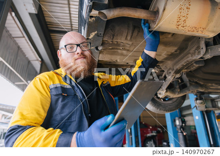 Portrait happy garage Mechanic worker in auto service center working service maintenance modern car. 140970267