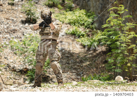 US Special forces soldiers engaged in combat operation, tactical military team in action 140970403