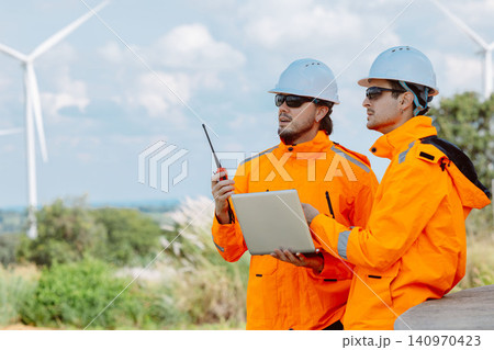 Engineering teamwork outdoor, Wind farm survey, Power generator renewable technology, Site inspect Engineering teamwork outdoor, Wind farm survey, Power generator renewable technology, Site inspect 140970423
