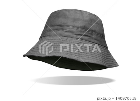 A black bucket hat is floating prominently against a white background. A black bucket hat is floating prominently against a white background. 140970519