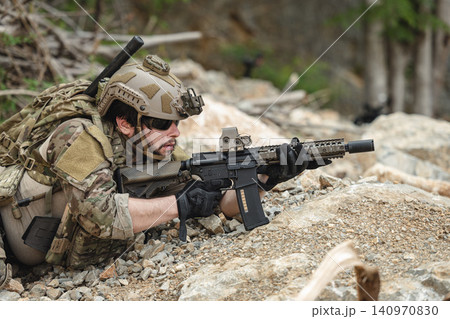 US Special forces soldiers engaged in combat operation, tactical military team in action US Special forces soldiers engaged in combat operation, tactical military team in action 140970830