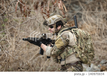 Military rangers, US Marine engaged in jungle combat operation deep in tropical forest 140970834