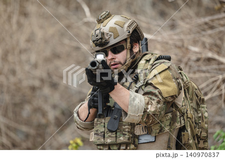 Military rangers, US Marine engaged in jungle combat operation deep in tropical forest Military rangers, US Marine engaged in jungle combat operation deep in tropical forest 140970837