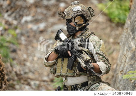 Military special forces soldier team in combat operation, tactical military portrait in action Military special forces soldier team in combat operation, tactical military portrait in action 140970949