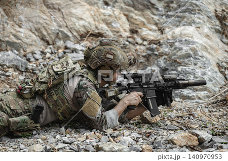 US Special forces soldiers engaged in combat operation, tactical military team in action US Special forces soldiers engaged in combat operation, tactical military team in action 140970953
