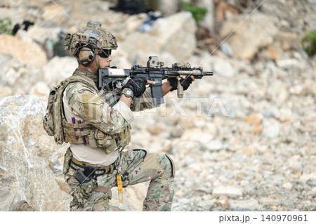 US Special forces soldiers engaged in combat operation, tactical military team in action US Special forces soldiers engaged in combat operation, tactical military team in action 140970961