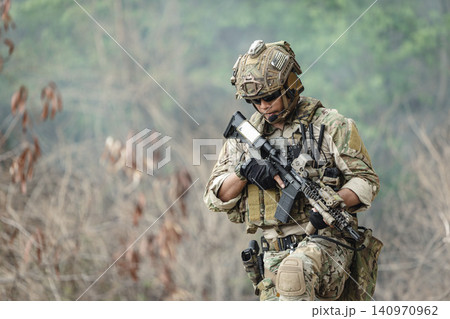 Military rangers, US Marine engaged in jungle combat operation deep in tropical forest Military rangers, US Marine engaged in jungle combat operation deep in tropical forest 140970962