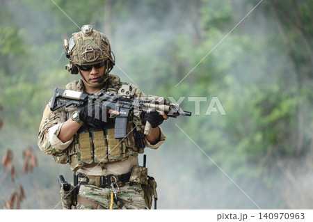 Military rangers, US Marine engaged in jungle combat operation deep in tropical forest Military rangers, US Marine engaged in jungle combat operation deep in tropical forest 140970963