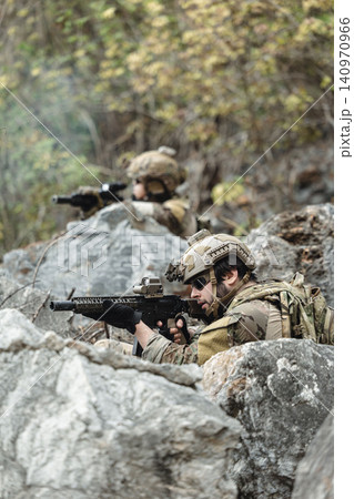 US Marine, Military Special forces soldier under heavy enemy fire intense battlefield engagement US Marine, Military Special forces soldier under heavy enemy fire intense battlefield engagement 140970966