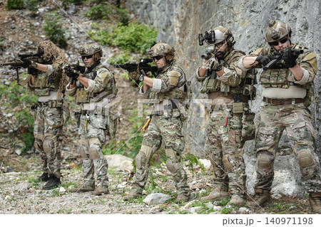 Military special forces soldier team in combat operation, tactical military portrait in action Military special forces soldier team in combat operation, tactical military portrait in action 140971198